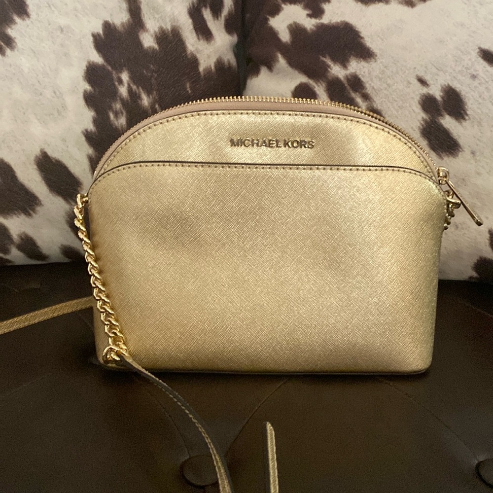 Michael Kors gold crossbody purse
True brand; NOT from outlet.